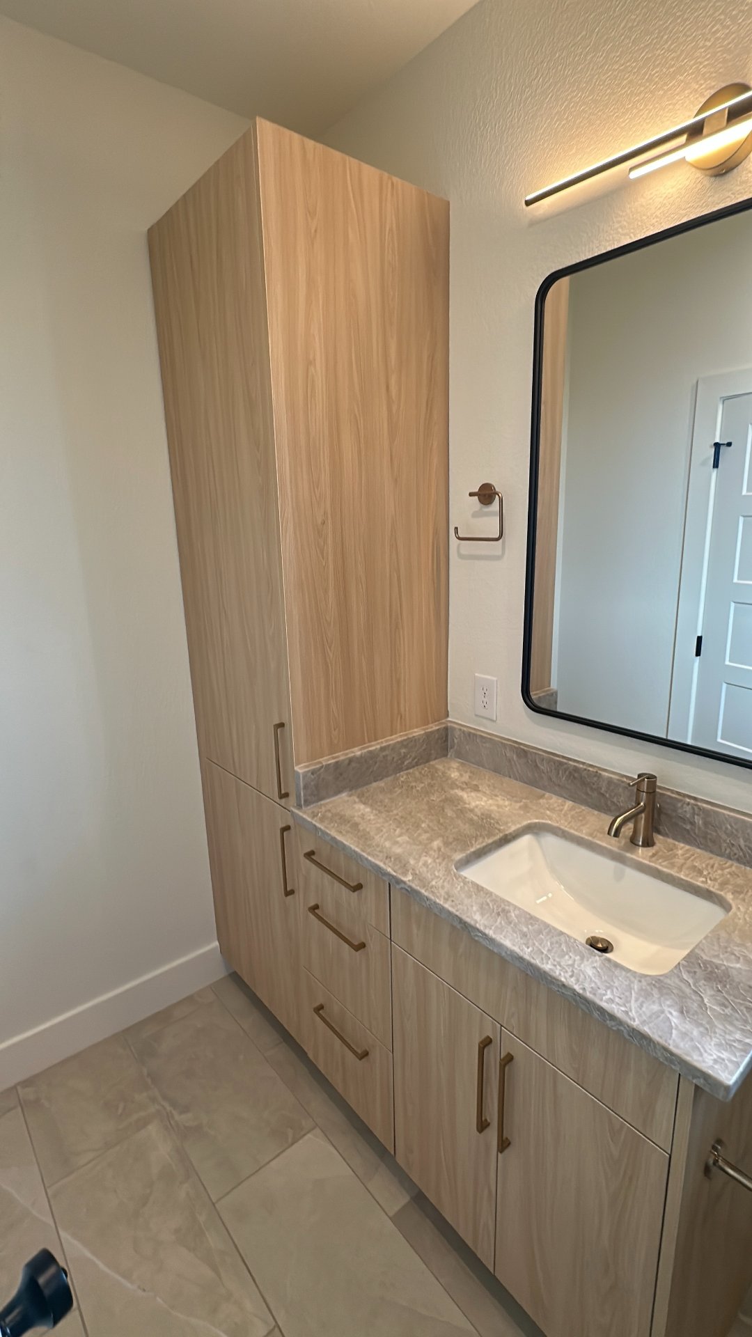 Moisture-resistant oak bathroom vanity in a Houston home