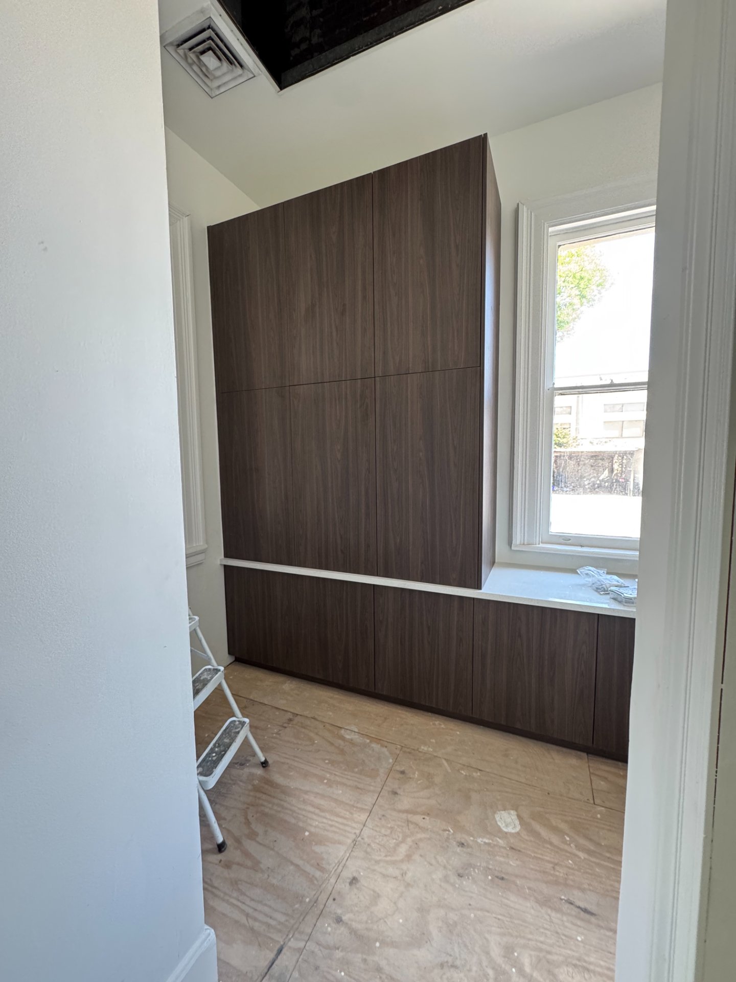 Custom walnut cabinets showing frameless construction